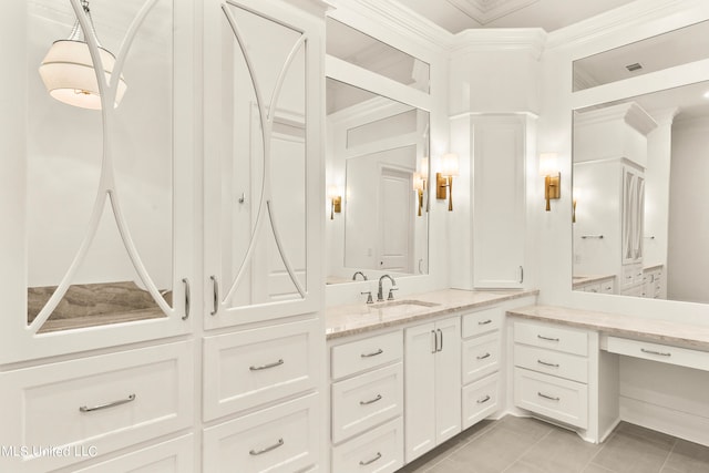 bathroom with vanity, crown molding, and tile patterned floors