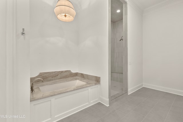 bathroom with tile patterned flooring, crown molding, and shower with separate bathtub