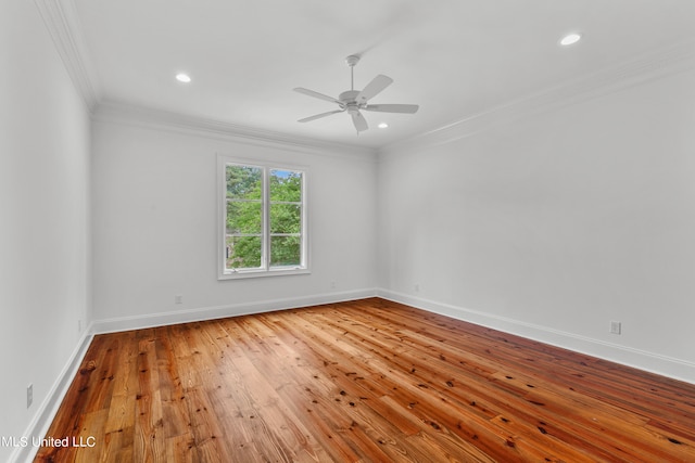 empty room featuring ornamental molding, hardwood / wood-style floors, and ceiling fan