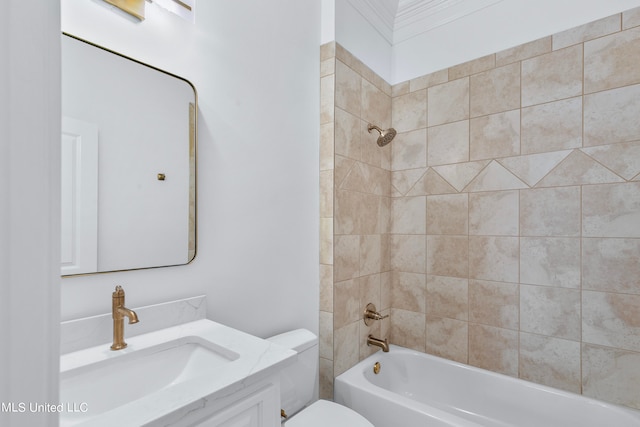 full bathroom with toilet, tiled shower / bath, and vanity