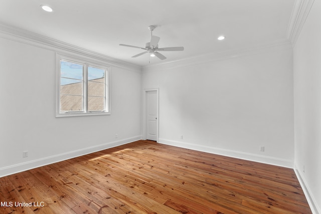 unfurnished room featuring hardwood / wood-style floors, crown molding, and ceiling fan