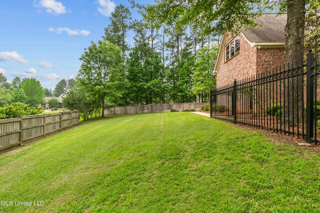 view of yard featuring a fenced backyard