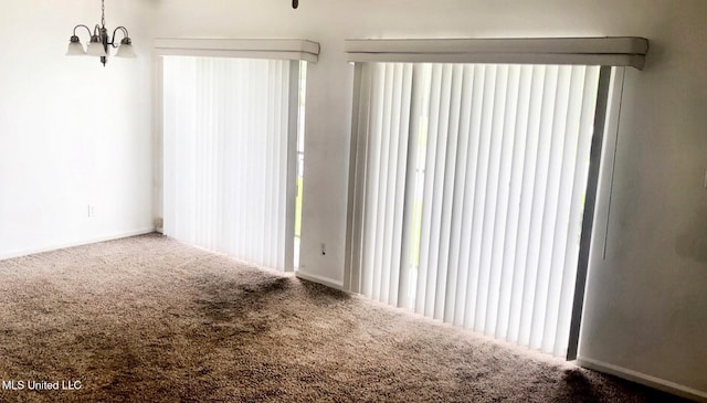 3230 Cumberland Rd Unit 78, Ocean Springs, MS 39564 - carpeted spare room featuring healthy amount of natural light and a chandelier