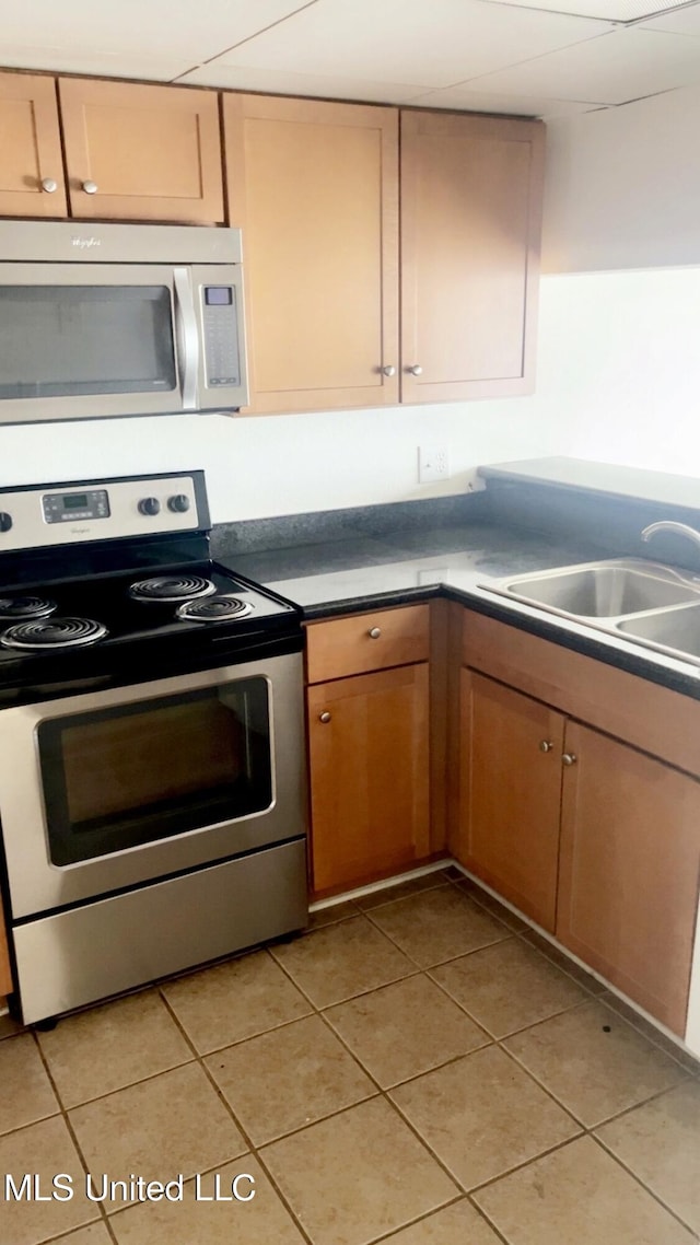 3230 Cumberland Rd Unit 78, Ocean Springs, MS 39564 - kitchen with stainless steel appliances and light tile patterned floors