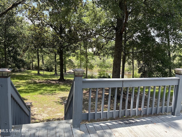 6825 Shore Dr, Ocean Springs, MS 39564 - deck featuring a yard and view of scattered trees