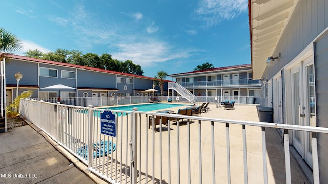 view of pool featuring a patio