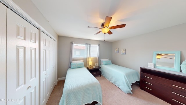 carpeted bedroom featuring ceiling fan