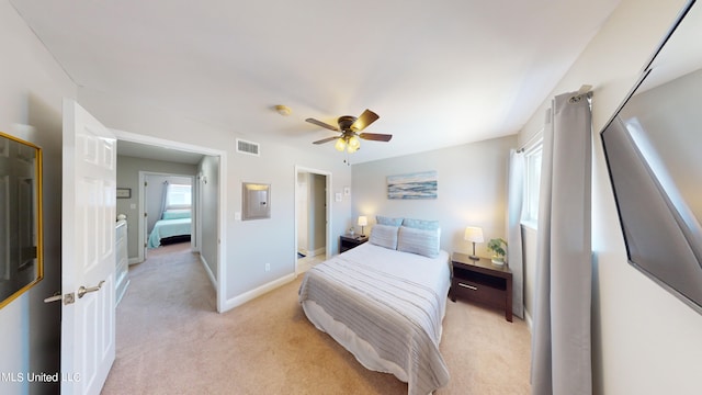 carpeted bedroom with ceiling fan