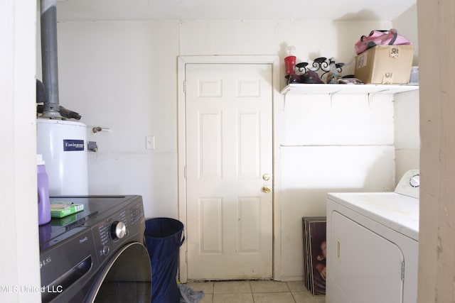 washroom with light tile patterned floors, water heater, and independent washer and dryer