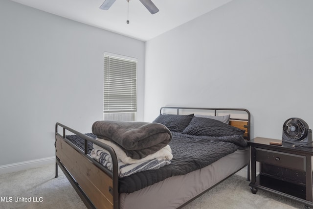 bedroom with baseboards, carpet, and a ceiling fan