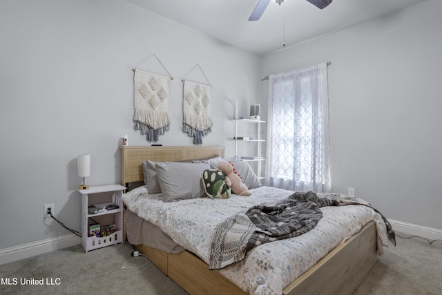 bedroom featuring baseboards, carpet, and a ceiling fan