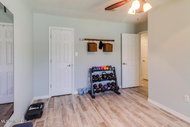 bedroom with light wood-style floors, baseboards, and a ceiling fan