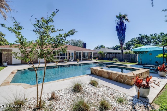 view of pool featuring an in-ground hot tub, fence, and a patio area