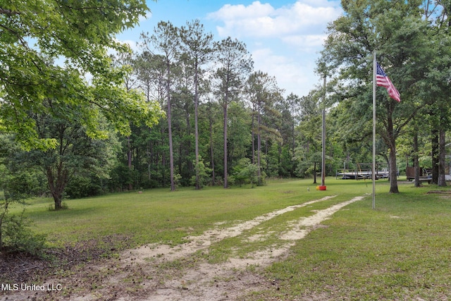 exterior space with a wooded view