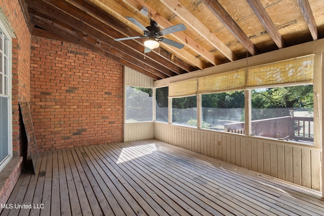 unfurnished sunroom featuring vaulted ceiling and ceiling fan