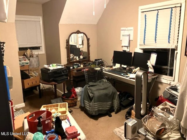 office area with lofted ceiling and carpet flooring