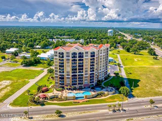 bird's eye view with a wooded view