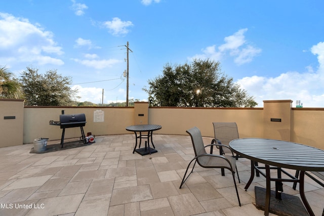 view of patio featuring a grill