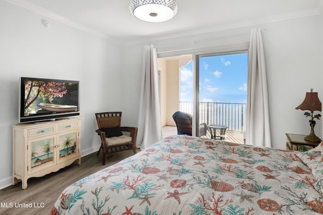 bedroom with crown molding, baseboards, wood finished floors, and access to exterior