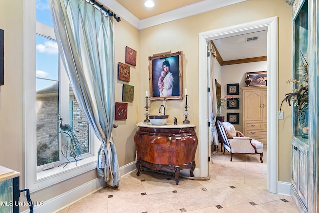 bathroom with tile patterned floors and crown molding