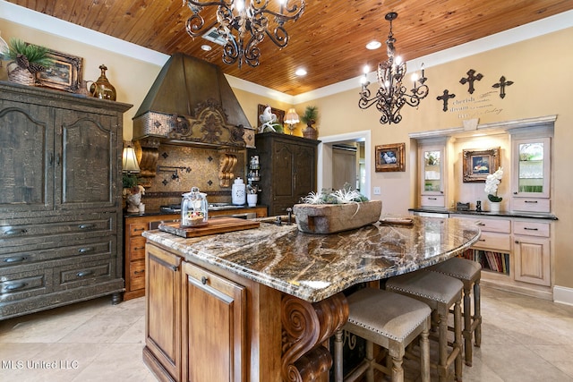 kitchen with a large island, an inviting chandelier, dark stone countertops, wood ceiling, and custom range hood