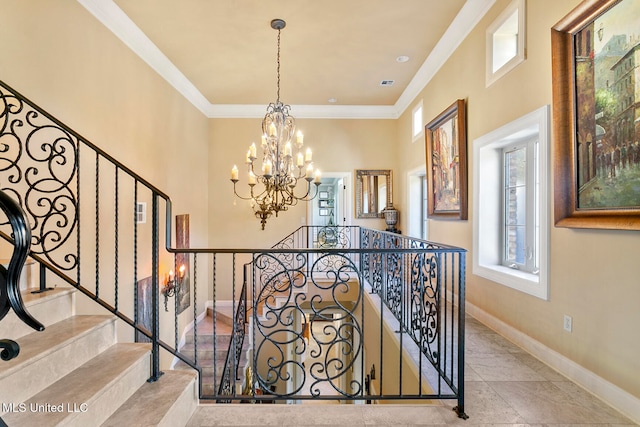 stairs with an inviting chandelier and ornamental molding