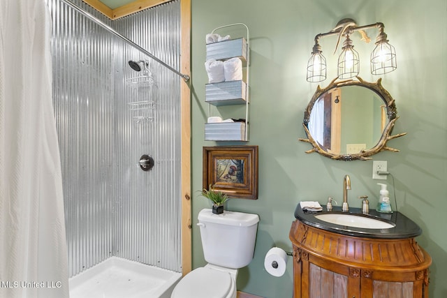 bathroom featuring vanity, toilet, and walk in shower