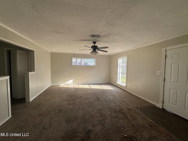 unfurnished room with crown molding, carpet flooring, visible vents, and a textured ceiling