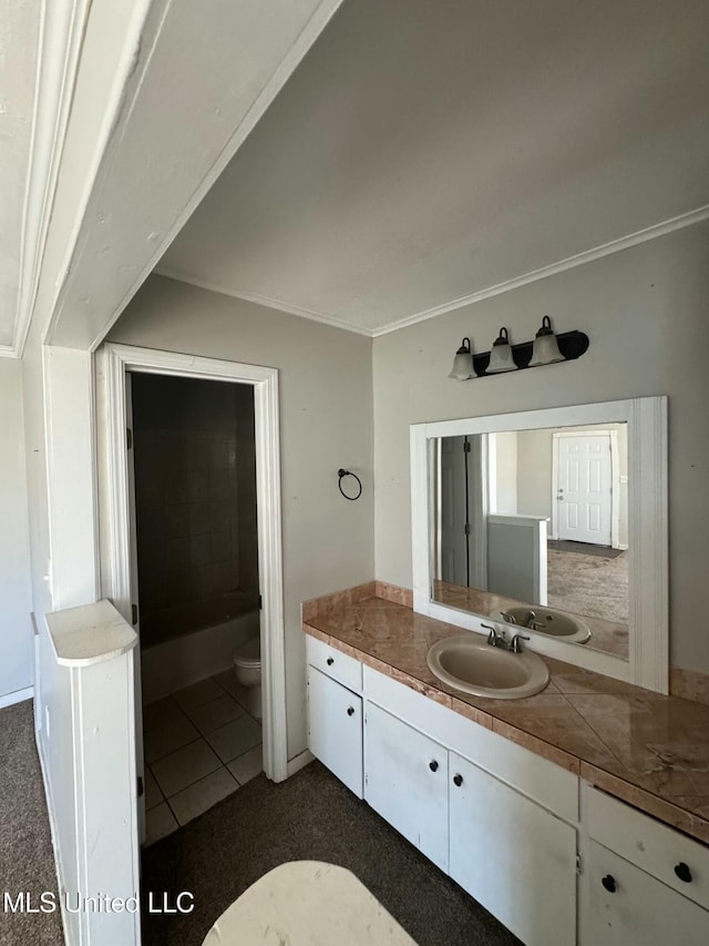 full bathroom with toilet, ornamental molding, and vanity