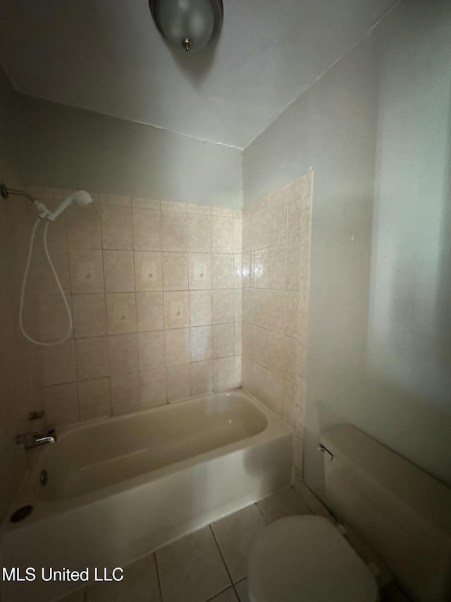 full bath featuring tile patterned flooring, toilet, and tub / shower combination