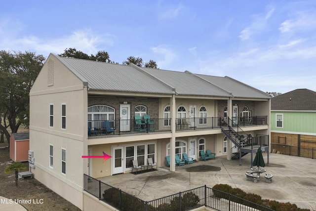 back of house with a patio area