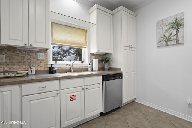 kitchen with sink, backsplash, white cabinets, light tile patterned flooring, and stainless steel dishwasher