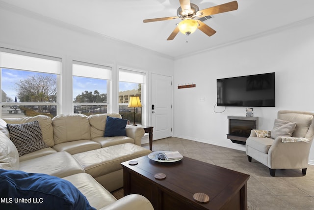 tiled living room featuring crown molding and ceiling fan