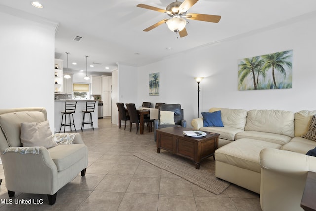 living room featuring ceiling fan and light tile patterned floors