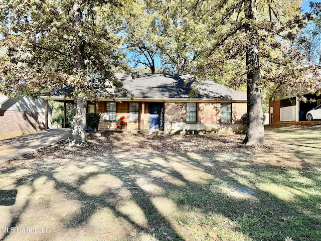 ranch-style home with a carport