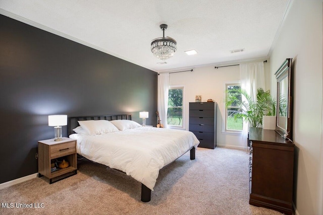 bedroom with light carpet, a textured ceiling, baseboards, and ornamental molding