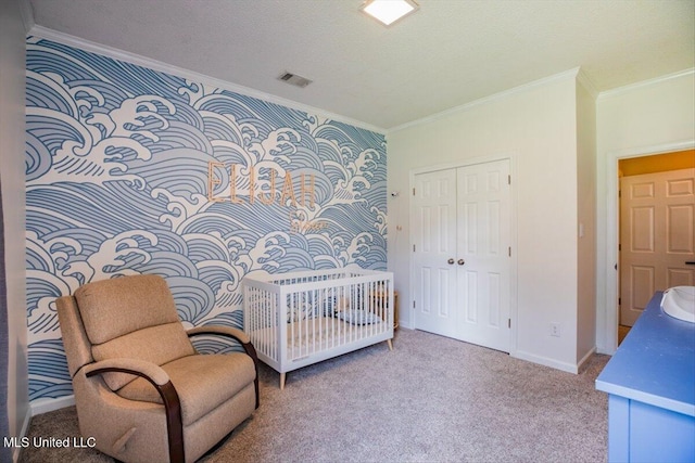 carpeted bedroom with visible vents, crown molding, baseboards, a closet, and a textured ceiling