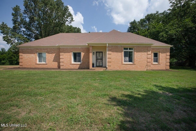 ranch-style house with a front lawn and brick siding