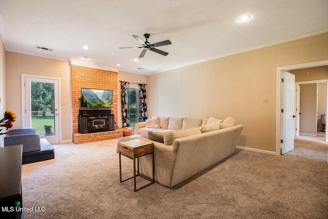 carpeted living area with visible vents, a textured ceiling, crown molding, and ceiling fan