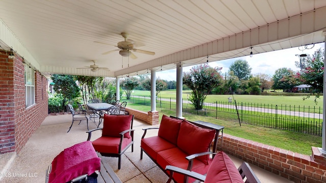 view of patio featuring ceiling fan and an outdoor living space