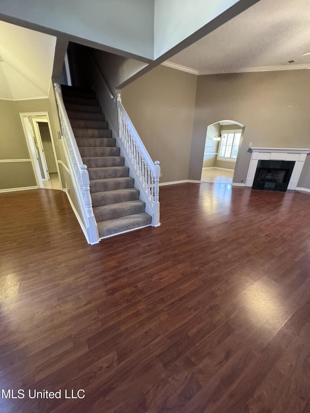 interior space with wood-type flooring and a tiled fireplace