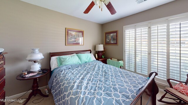 carpeted bedroom featuring ceiling fan