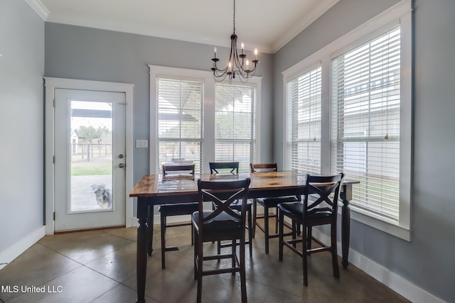 dining area with crown molding and a notable chandelier