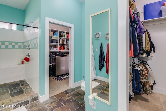 bathroom featuring toilet and a shower