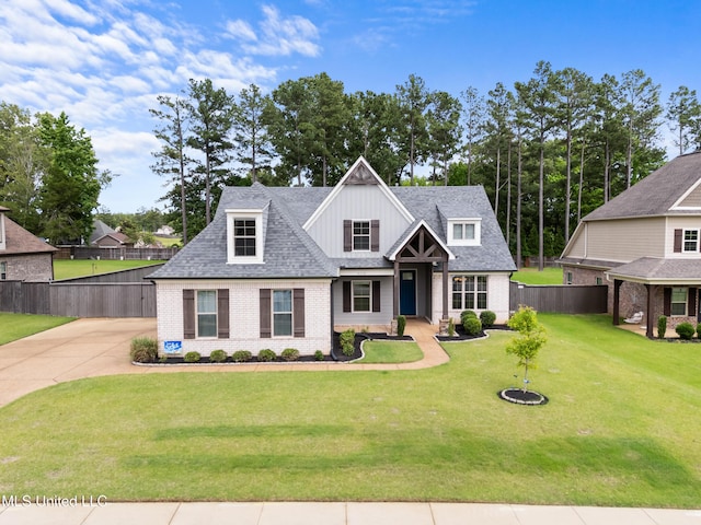 5110 Kensington Creek Dr, Southaven, MS 38672 - view of front of property featuring brick siding, board and batten siding, concrete driveway, and a shingled roof