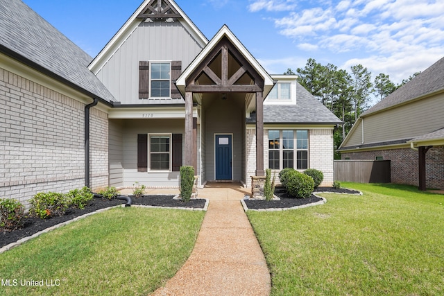 5110 Kensington Creek Dr, Southaven, MS 38672 - view of front of house featuring brick siding, board and batten siding, and roof with shingles