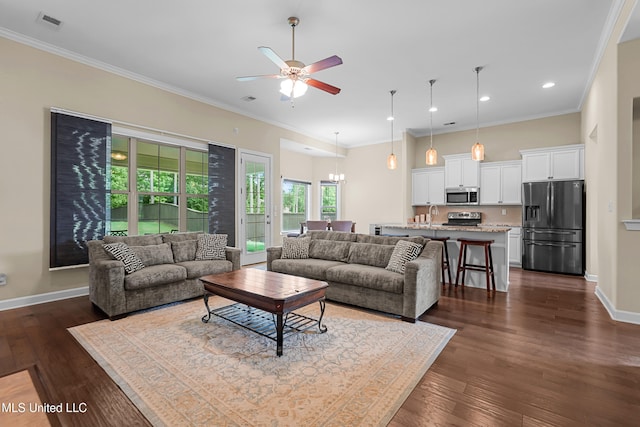 5110 Kensington Creek Dr, Southaven, MS 38672 - living area featuring ceiling fan, dark wood-style flooring, ornamental molding, recessed lighting, and a chandelier