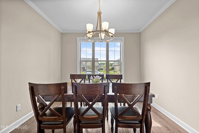 5110 Kensington Creek Dr, Southaven, MS 38672 - dining space featuring a chandelier, wood finished floors, and ornamental molding