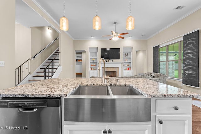 5110 Kensington Creek Dr, Southaven, MS 38672 - kitchen with stainless steel dishwasher, a ceiling fan, ornamental molding, light stone countertops, and open floor plan