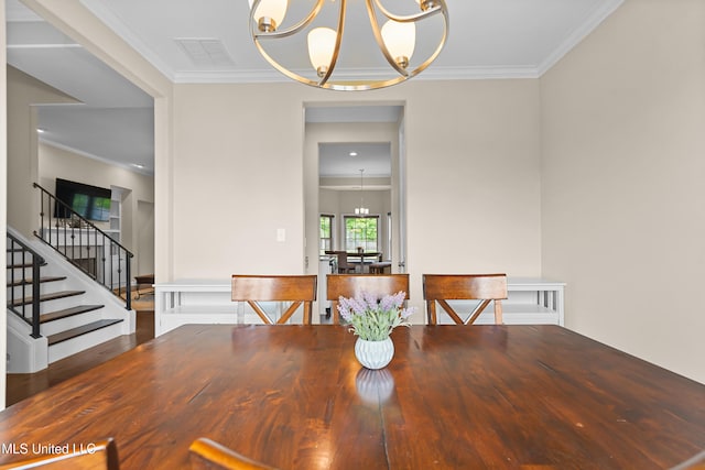 5110 Kensington Creek Dr, Southaven, MS 38672 - dining area with a chandelier, stairs, and ornamental molding